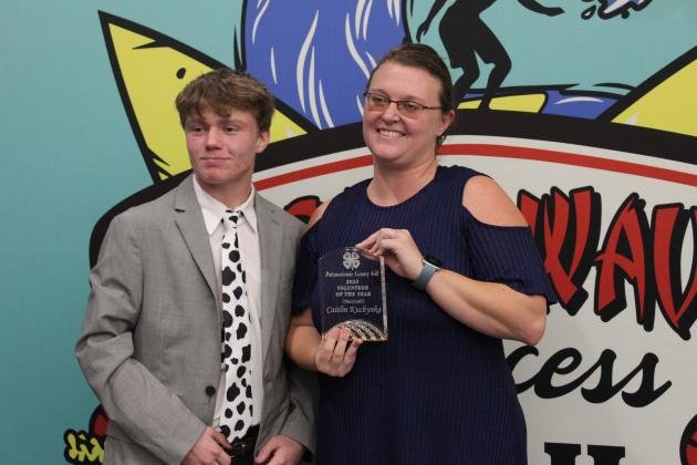 Caitlin Kuchynka accepts the Pottawatomie County 4-H 2023 Volunteer of the Year Award from 4-H Vice-President Taylor Marrs during the county 4-H Awards Banquet on Oct. 23. Countywide &amp; Sun/Natasha Dunagan