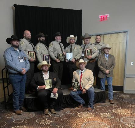 Multiple awards were received by the Pottawatomie County Deputies at the Oklahoma Sheriffs Association annual Banquet. Pictured back row, from left: Sergeant Jason Seikel-Life saving award, Deputy Steve Partain-Reserve Deputy of the year, Deputy Dustin Richardson-Meritorious service award, Deputy Steven Warren-meritorious service award, Lieutenant James Caskey-Life saving award &amp; Meritorious service award, and Deputy Justin Robbins-Life saving award.