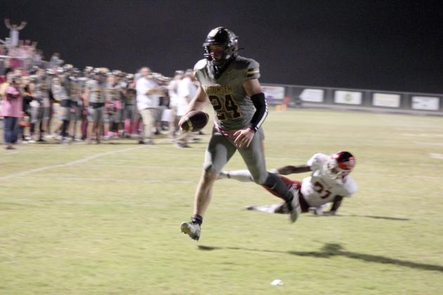 Tecumseh senior Braxton Meier leaves a Tuttle defender in his wake and makes a touchdown in the third quarter of the home game, Oct. 20. The Savages lost, 6-50. Countywide &amp; Sun/Natasha Dunagan