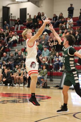 Dale's Denton Forsythe shoots for three in the third quarter of the Nov. 17 home game with Amber-Pocasset. The Pirates won, 84-24. The Lady Pirates also won that night, 46-18. Countywide &amp; Sun/Natasha Dunagan