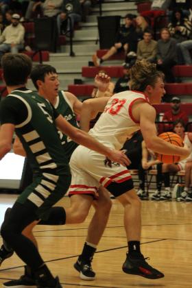Dale's Dayton Forsythe charges through the Amber-Pocasset defense in the second half of the Nov. 17 home game. The Pirates won, 84-24. The Lady Pirates also won that night, 46-18. Countywide &amp; Sun/Natasha Dunagan