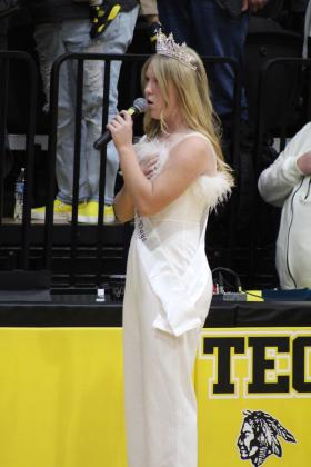 Miss Frontier Days Alleigha McCullough sings the national anthem before the game.