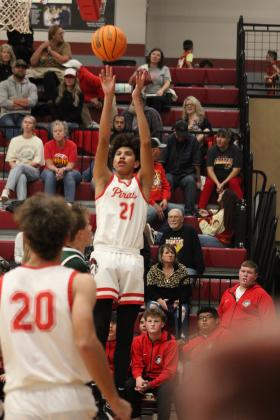Dale's Keldon Meely tries for three points in the second half of the Nov. 17 home game with Amber-Pocasset. The Pirates won, 84-24. The Lady Pirates also won that night, 46-18. Countywide &amp; Sun/Natasha Dunagan
