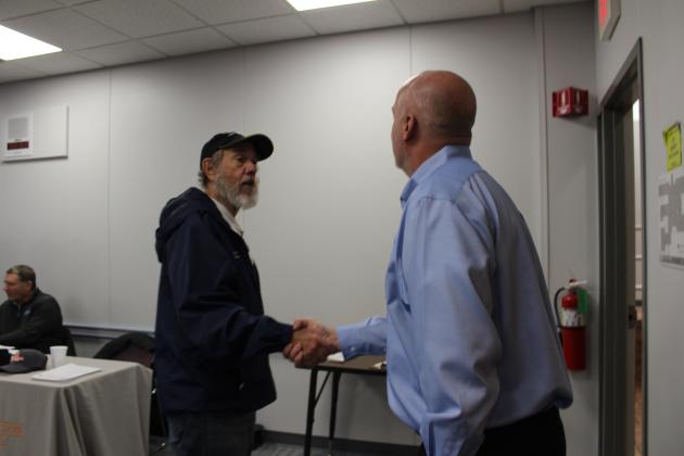 OESC Disabled Veteran's Program Specialist Dru Tischer, right, shakes hands with American Legion Post 16 Veteran Service Officer Jim Vaughn during the Oklahoma Employment Security Commission Veterans/Community Job Club on Nov. 2 at Gordon Cooper Technology Center. Ten veterans attended the event. Countywide &amp; Sun/Natasha Dunagan