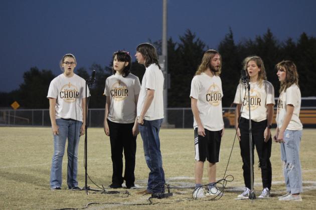 Tecumseh Choir's seniors sing the national anthem before the Nov. 3 home game. They are, from left, Zoey Edwards, Brody Dunagan, Ryley Hogue, Coalton Reece, Calyn Harris, and Mackenzie Stiles. Countywide &amp; Sun/Natasha Dunagan