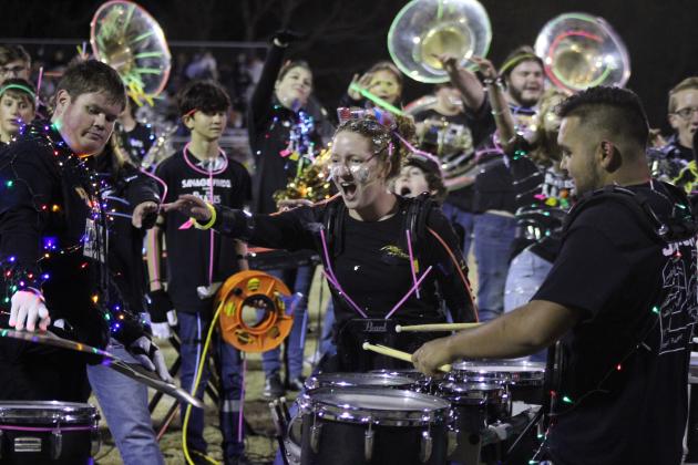 Tecumseh drummers Josh Tauscher and Laycee Thoma and the rest of the band enjoy a performance by Alan Lopez-Moreno, far right, following their annual light show at halftime of the Senior Night home game Nov. 3. Countywide &amp; Sun/Natasha Dunagan