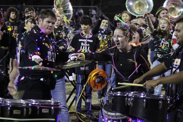 Tecumseh drummers Josh Tauscher and Laycee Thoma and the rest of the band enjoy a performance by Alan Lopez-Moreno, far right, following their annual light show at halftime of the Senior Night home game Nov. 3. Countywide &amp; Sun/Natasha Dunagan