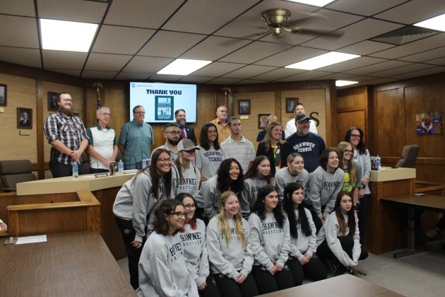 Dick's Sporting Goods donated $75,000 to the Shawnee tennis and wrestling programs and was recognized during the Nov. 2 Shawnee Board of Education meeting. Shown are members of the Shawnee Girls Wrestling Team, Head Wrestling Coach Andrew McCune, Assistant Athletic Director Julia Holland, two tennis players, Girls Tennis Coach John Stobbe, and Boys Tennis Coach Dacia Jordan. Countywide &amp; Sun/Natasha Dunagan