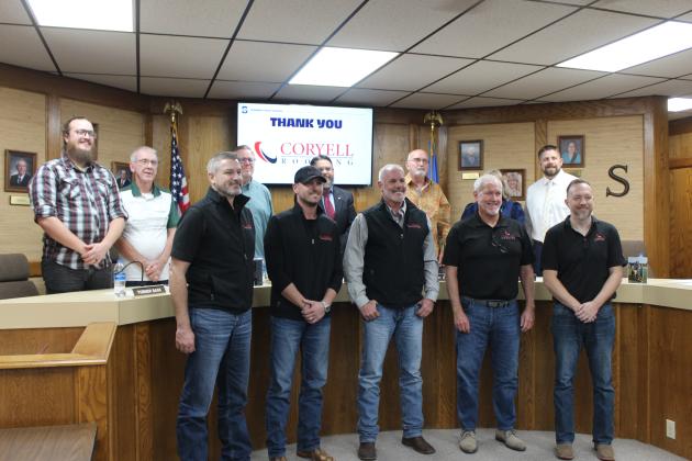 The crew from Coryell Roofing is honored for their donation.