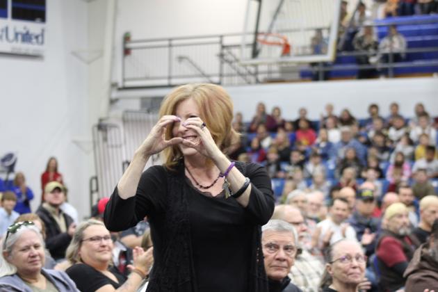 Bethel High School English Teacher Ronda Speed makes the sign of the heart to her students after being announced at the Bethel High School Veterans Day Program on Nov. 10 at the newly remodeled gym. Speed served in the Air Force for two years as a morse code interceptor. She said she asked that they include the veterans' job titles along with their names at the event this year so students could see the range of jobs in the military. Countywide &amp; Sun/Natasha Dunagan