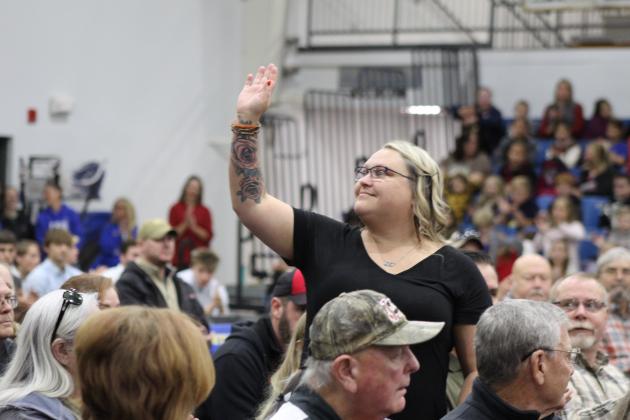Military Police Army Veteran Dana Farley waves after her names is called during the Bethel High School Veterans Day Program on Nov. 10. Countywide &amp; Sun/Natasha Dunagan