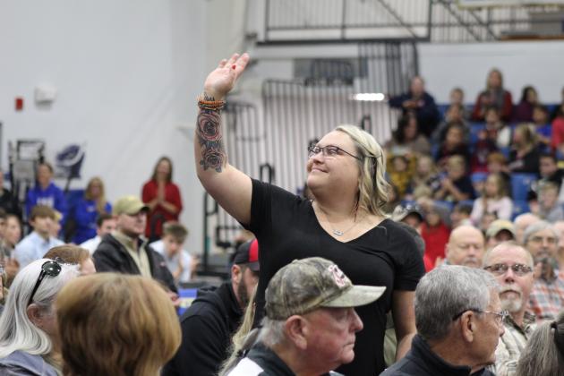 Military Police Army Veteran Dana Farley waves after her names is called during the Bethel High School Veterans Day Program on Nov. 10. Countywide &amp; Sun/Natasha Dunagan