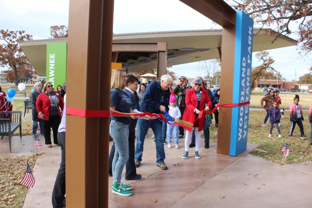 Shawnee Mayor Ed Bolt cuts the ribbon on the newly renovated Woodland Veterans Park on Nov. 11. Countywide &amp; Sun/Natasha Dunagan