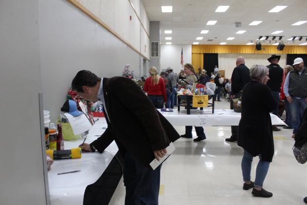 State Sen. Shane Jett places a bid at the silent auction.
