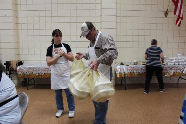 Katie Overstreet and J.R. Kidney volunteer on Thanksgiving.