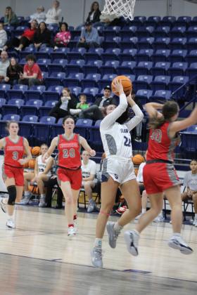 Shawnee junior Serenity Casteel makes two points and gets the foul in the third quarter of the Dec. 15 game against Crossings Christian. Playing back on the newly-repaired Performing Arts and Athletic Center, the Lady Wolves won, 56-34. The Wolves came up short, 47-67. Countywide &amp; Sun/Natasha Dunagan