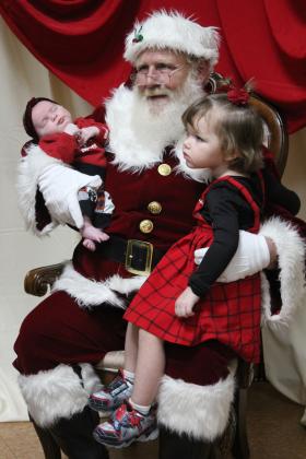 Santa holds GwendoLynn Newhoff, one month old, and KaMaya Napier, 3, both of Shawnee, during the Grinchmas Whoville event, held in the Tecumseh City Hall Auditorium on Nov. 30. Both "Selfies with Santa" and the Grinch photos were sponsored by the Tecumseh Pioneer Library. Countywide &amp; Sun/Natasha Dunagan