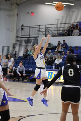 Bethel senior Brooklyn Duff puts up a three-point shot in the First United Basketball Classic Girls Finals against Tecumseh, held at Bethel High School on Dec. 9. The Lady Wildcats won their first two games with Mt. St. Mary and McLoud, then lost to the Lady Savages, 46-55, taking the second-place trophy. Countywide &amp; Sun/Natasha Dunagan