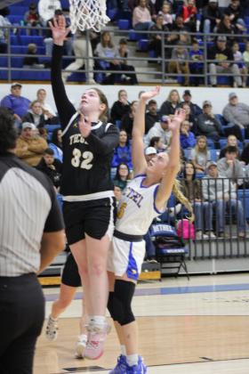 Tecumseh senior Reagan Berry makes her shot, as Bethel senior Brooklyn Duff plays defense, in the First United Basketball Classic Girls Finals, held at Bethel High School on Dec. 9. The Lady Savages won all three of their games at the three-day tournament with Perkins-Tryon and Sallisaw, and finally, the Lady Wildcats, 55-46. Countywide &amp; Sun/Natasha Dunagan