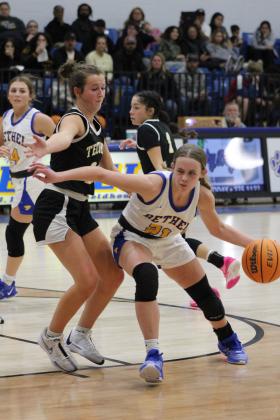 Bethel's Josie Megehee drives toward the basket, guarded by Tecumseh's Emily Gage, in the First United Basketball Classic Girls Finals, held at Bethel High School on Dec. 9. The Lady Wildcats won their first two games with Mt. St. Mary and McLoud, then lost to the Lady Savages, 46-55, taking the second-place trophy. Countywide &amp; Sun/Natasha Dunagan