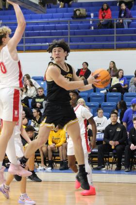 Tecumseh's Macen McKiddy grabs the rebound and looks to pass in the Consolation Round of the First United Basketball Classic against McLoud, held on Dec. 9 at Bethel High School. McLoud won, 60-39, for the third-place trophy. Countywide &amp; Sun/Natasha Dunagan