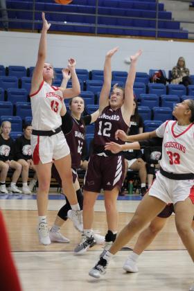 McLoud's Creighton Conley (#13) makes two points in the fourth quarter of the game with Blanchard at the First United Basketball Classic, held at Bethel High School on Dec. 7. McLoud won that game, 50-30. Then, they lost to Bethel, 39-43, and beat Sallisaw, 41-37. Countywide &amp; Sun/Natasha Dunagan