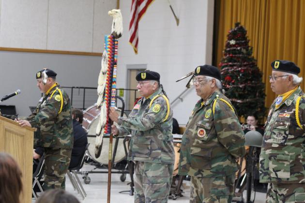 Members of the Seminole Nation Honor Guard - Rex Hailey, Tecumseh Underwood, Alex Fish and Walter Larney - participate in the National Wreaths Across America Day ceremony at the W.P. Wood/THS Alumni Center on Dec. 16. Hailey spoke about and sang their native song, "Yvmv Estemerketv," which is about the Seminoles' "pain, suffering and sorrow," said Hailey, and dates back to the early 1800s. Countywide &amp; Sun/Natasha Dunagan