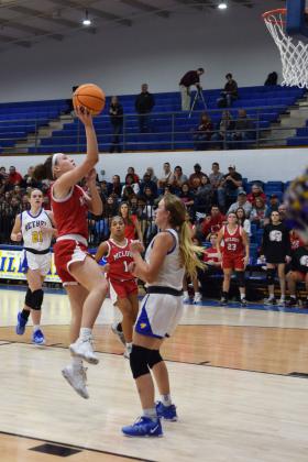Mcloud's Creighton Conley takes a shot during the First United Basketball Classic tournament against Bethel last Friday night.  Bethel won, and then lost to Tecumseh in the Championship game the following night.  Countywide/Sun Julie Talton