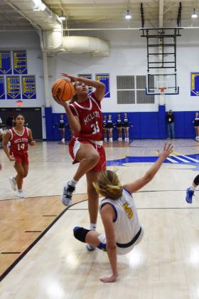 Mcloud's Taycee Lewis shoots for two during the First United Basketball Classic tournament against Bethel last Friday night.  Bethel won, and then lost to Tecumseh in the Championship game the following night.  Countywide/Sun Julie Talton