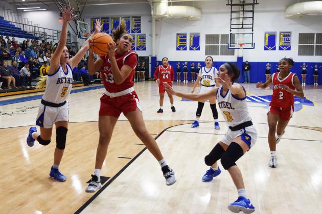 Mcloud's Taycee Lewis shoots for two during the First United Basketball Classic tournament against Bethel last Friday night.  Bethel won, and then lost to Tecumseh in the Championship game the following night.  Countywide/Sun Julie Talton