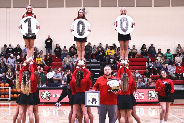 North Rock Creek recognized Coach Evan Smith for his 100th win as a head coach, Tuesday, Dec. 12. The NRC back-2-back State softball championship team was also recognized. NRC played Tecumseh Tuesday night and won both games. Girl's score was 55-47 and the boys 71-38. Photo provided courtesy of Gowin Photography