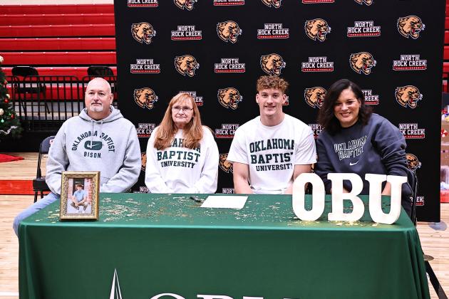 North Rock Creek's Maddox Motley signs with Oklahoma Baptist University. Pictured (from left) are parents Chris and Angela Motley, Maddox, and Grandmother Dorothy Motley. Photo courtesy of Gowin Photography