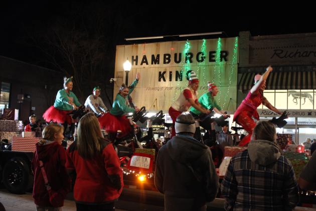 Members of Lifted Fitness Studio ride their stationary bikes while riding in the Shawnee Christmas Parade on Dec. 8. Countywide &amp; Sun/Natasha Dunagan