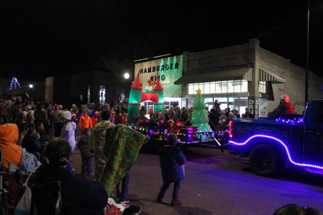 M-Pact Baseball players ride on or walk behind their float in the Shawnee Christmas Parade on Dec. 8. With the theme "Christmas in Toyland," there were 80 parade entries this year. Countywide &amp; Sun/Natasha Dunagan