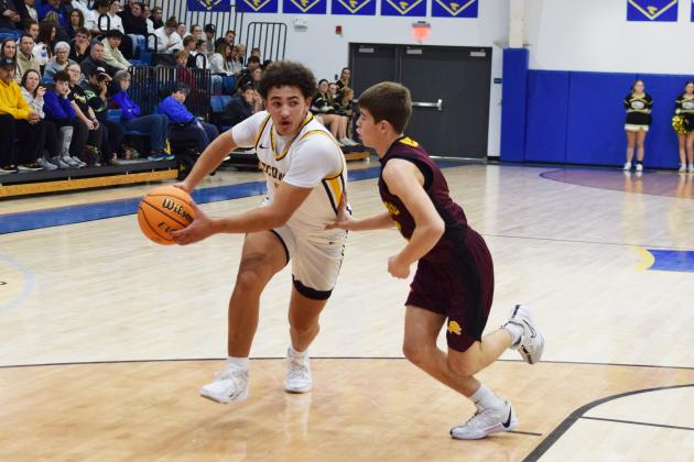 Tecumseh's Aveon Stokes drives the ball to the post during the First United Basketball Classic tournament against Blanchard last Friday night.  Countywide/Sun Julie Talton