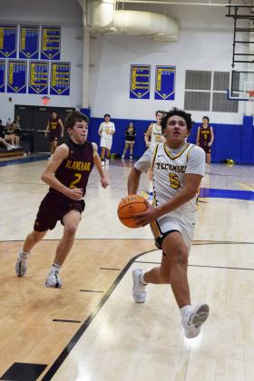 Tecumseh's Aveon Stokes races to the paint during the First United Basketball Classic tournament against Blanchard last Friday night.  Countywide/Sun Julie Talton
