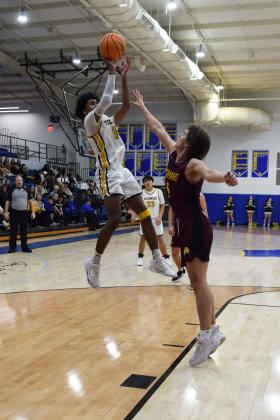 Tecumseh's Jace Edwards makes two during the First United Basketball Classic tournament against Blanchard last Friday night.  Countywide/Sun Julie Talton