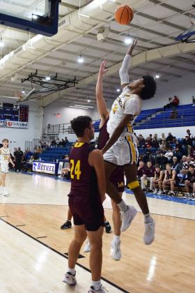 Tecumseh's Jace Edwards flies high for two during the First United Basketball Classic tournament against Blanchard last Friday night.  Countywide/Sun Julie Talton