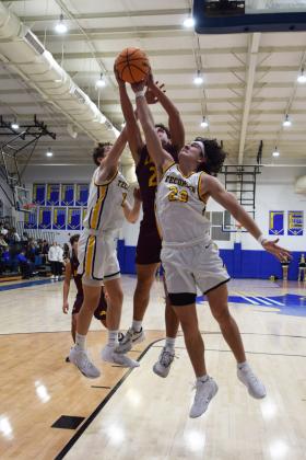 Tecumseh's Macen Mckiddy jumps for the ball during the First United Basketball Classic tournament against Blanchard last Friday night.  Countywide/Sun Julie Talton