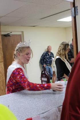 Miss Frontier Days Aleigha McCullough and Junior Miss Frontier Days Kensley Whittington works the free hot cocoa booth at the Grinchmas Whoville event, held in the Tecumseh City Hall Auditorium on Nov. 30. Countywide &amp; Sun/Natasha Dunagan