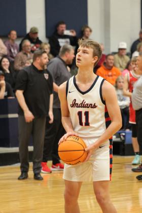 While the Vanoss coaches dispute the call with a referee in the background, Asher's Andrew Overstreet concentrates on shooting free throws in the second quarter of the Jan. 12 home game. The Indians won, 55-44. Countywide &amp; Sun/Natasha Dunagan