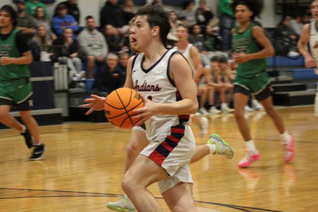 Asher's Gunnar Lehman sprints to the bucket, having stolen the ball in the second quarter of the Jan. 2 home game with Varnum. Countywide &amp; Sun/Natasha Dunagan