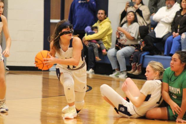 Asher's Cadence Leba recovers the ball and looks to pass in the home game with Varnum on Jan. 2. Countywide &amp; Sun/Natasha Dunagan
