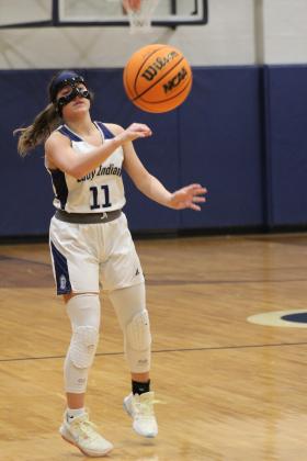 Asher's Cadence Leba passes in the home game with Varnum on Jan. 2. The Lady Indians lost, 38-52. Countywide &amp; Sun/Natasha Dunagan