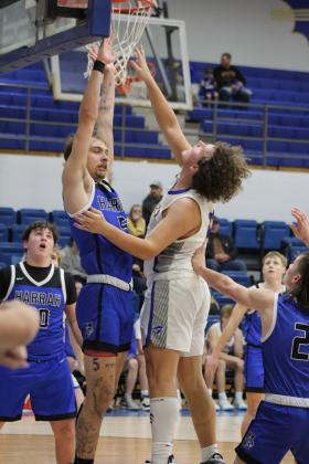 After an assist from senior Jake Stephenson, junior Cale Duncan puts one in the bucket during the home game with Harrah on Jan. 9.  The Wildcats won, 48-42. Countywide &amp; Sun/Natasha Dunagan