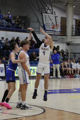 Bethel senior R.J. Morris tries for a three-pointer during the home game with Harrah on Jan. 9.  The Wildcats won, 48-42. Countywide &amp; Sun/Natasha Dunagan