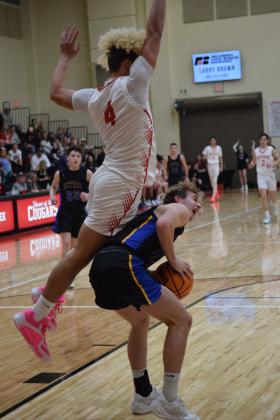 Bethel's Jake Stephenson draws a foul on JJ McClain during their game agains North Rock Creek on January 12th. The Cougars won the battle 68-57 Countywide &amp; Sun/Julie Talton