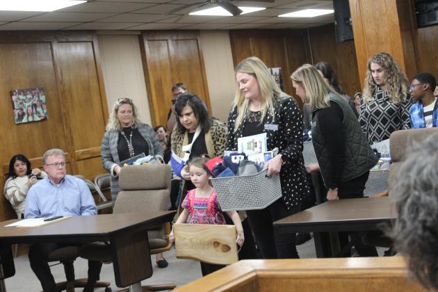 Ready with gift baskets for the school board.