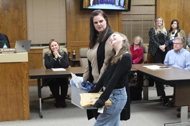 Will Rogers Principal Molly Wilson introduces fifth-grader Elinor Crane.