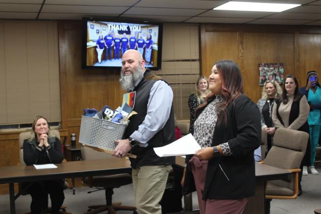 Shawnee High School student Kanynn Kaseca expresses her appreciation for the Shawnee Board of Education as SHS Principal Matt Johnson listens during the Jan. 8 meeting. Countywide &amp; Sun/Natasha Dunagan
